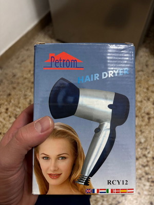 Travel hair dryer used, ideal for gym