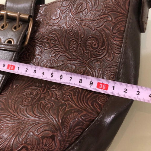 Women's brown shoulder bag used with embossed design