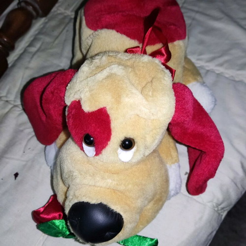 Stuffed dog used with heart and flower