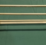 Brass wall-mounted hanger used