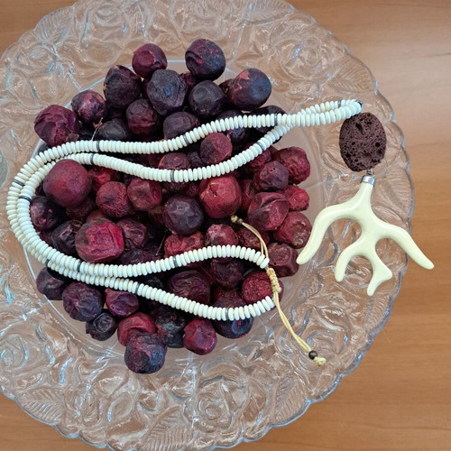 Necklace with white round beads and brown branch motif pendant like new