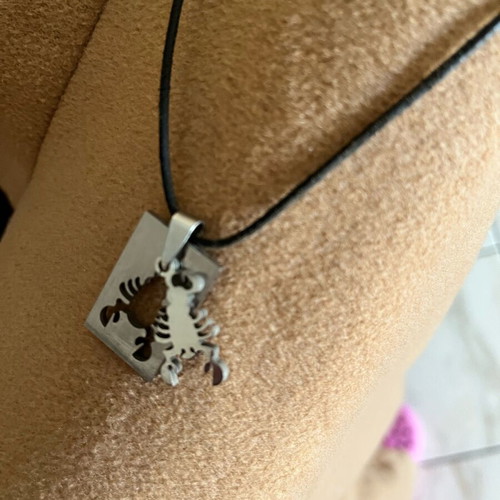 Scorpio zodiac necklace like new stainless steel with leather cord