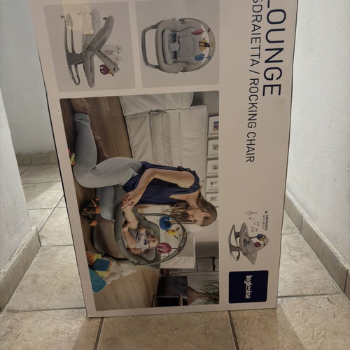 Inglesina Lounge rocking chair used for babies with music toys