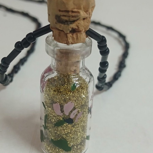 Handmade pendant glass bottle with gold glitter and beaded chain