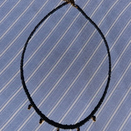 Necklace with black glass beads and gold-plated drops made of steel wire new