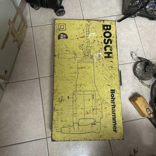 Bosch floor jackhammer used with accessories and metal case