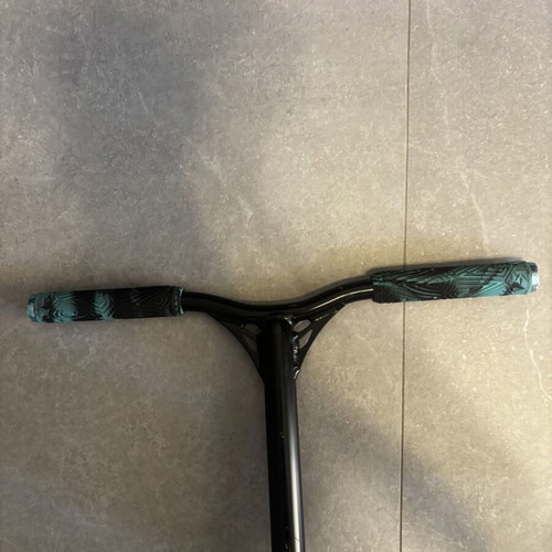 Scouter Envy scooter used with new handles, wheels, and grip tape