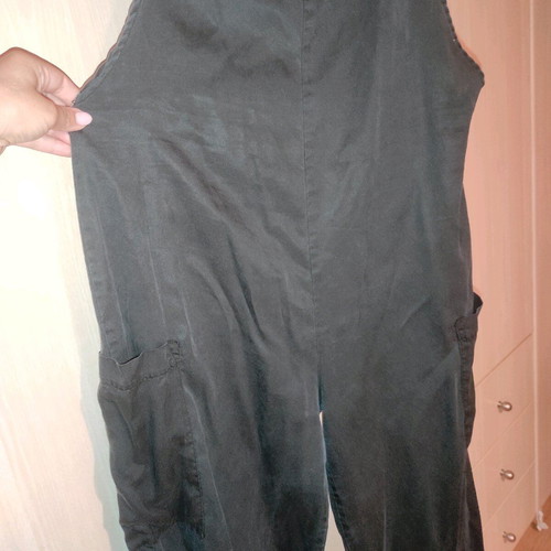 One-piece jumpsuit used, black with side pockets