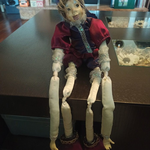 Wind-up Pierrot Harlequin doll used with music