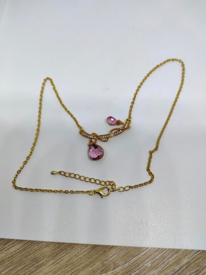 Pendant with pink crystals and gold chain like new
