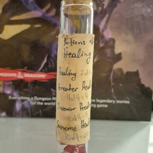 Dnd healing potion with 10 red tetrahedral dice in bottle