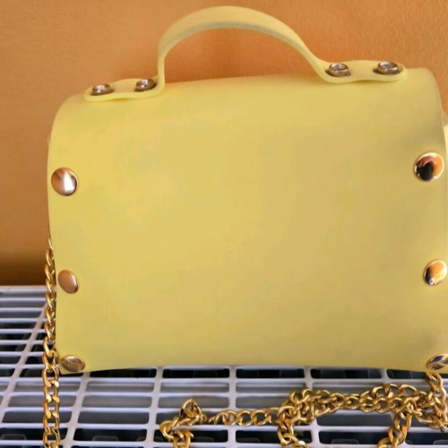 Women's yellow shoulder bag made of foam, used