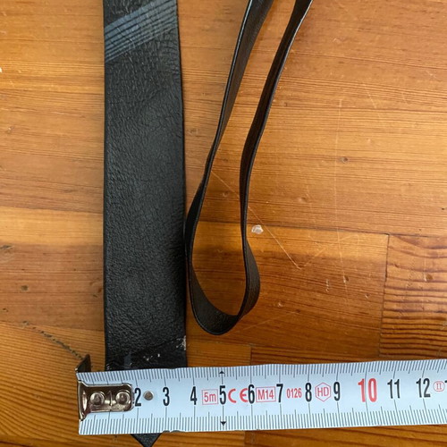 Leather thin black tie vintage used with fading marks