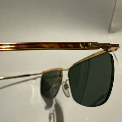 Vintage Vogue sunglasses with gold metal frame and green lenses