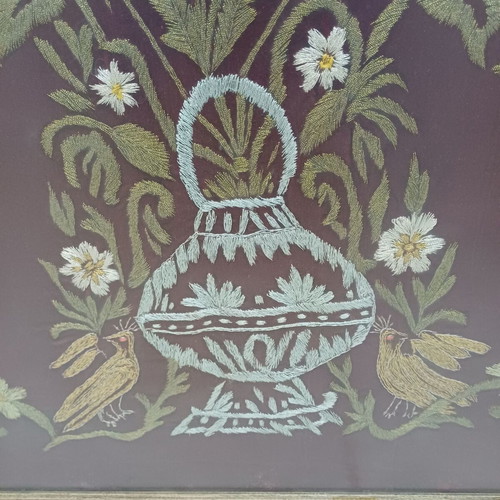 Embroidered textile painting used with silver and gold thread on velvet