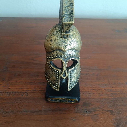 Decorative replica of ancient Greek Corinthian helmet used, bronze patina