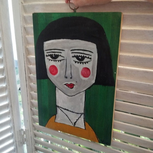 Wood painting of a face