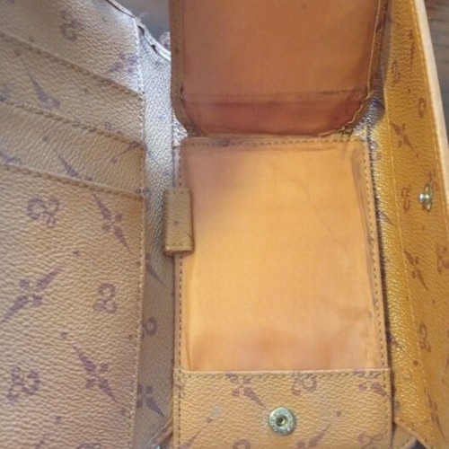 Wallet used camel color with many pockets and minor defect