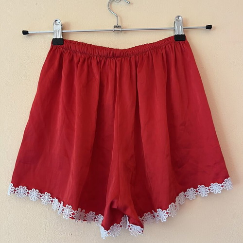 A-Style satin red shorts used with white flowers