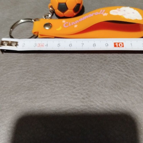 Keychain with orange football ball made of rubber new