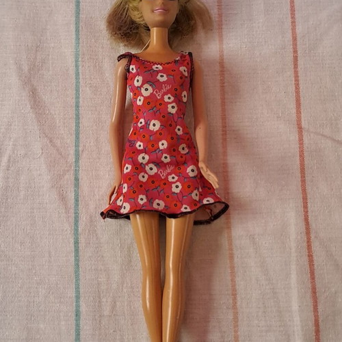Barbie doll used with modern dress and painted cut hair