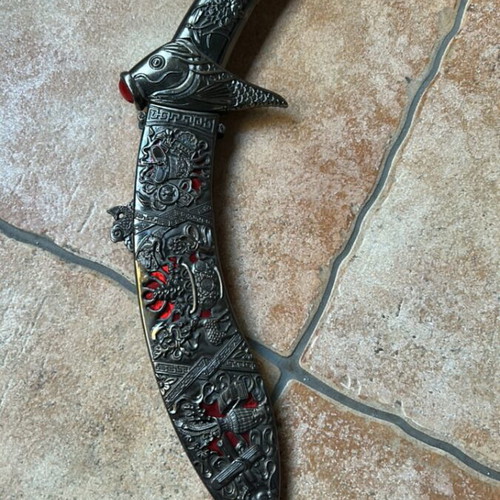 Chinese Decorative Stiletto Knife like new with embossed blade and fish handle