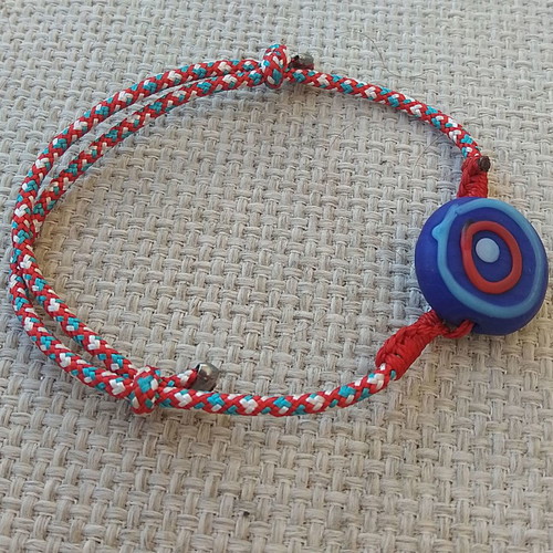 Martis bracelet handmade with cord and polymer clay eye made to order