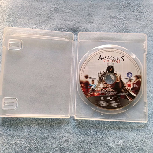 PlayStation 3 (PS3) like new with cable, controller and Assassin's Creed II