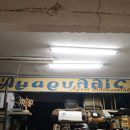 Old wooden sign used from tailoring shop