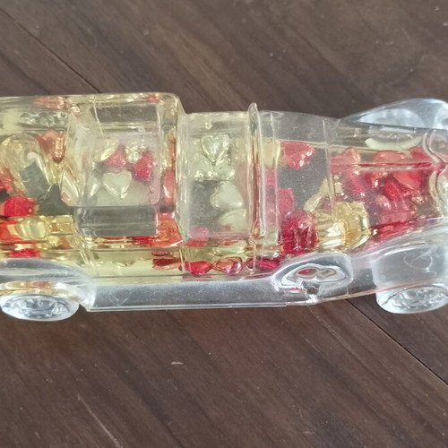 Vintage novelty pen holder used, car shaped with moving hearts