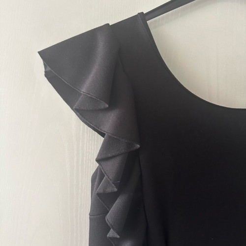 Black dress with structured fabric like new, ruffles and back V, size M