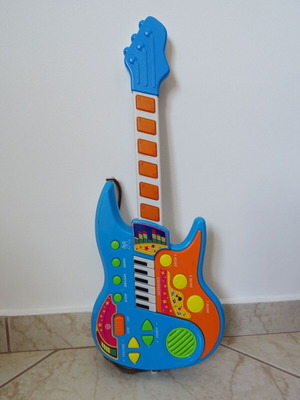 Children's electric guitar used with sound, keys and lights