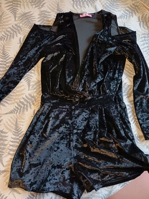Black velvet jumpsuit like new with deep neckline and off-shoulder design