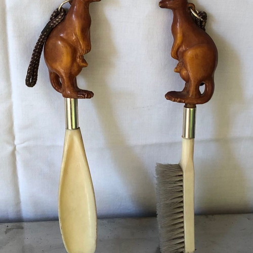 Shoe brush and shoehorn set used with kangaroo sculpture