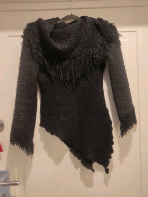 Knitted women's asymmetrical sweater black with fringes