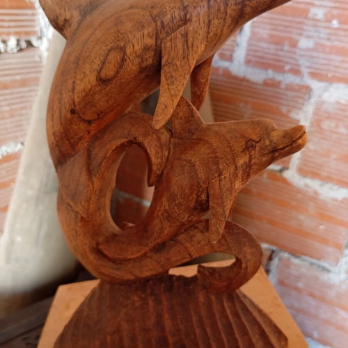Handcrafted wooden sculpture of two dolphins, unique piece