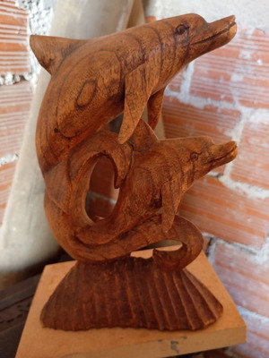 Handcrafted wooden sculpture of two dolphins, unique piece