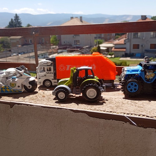 Lot of 4 used medium-sized children's toy vehicles