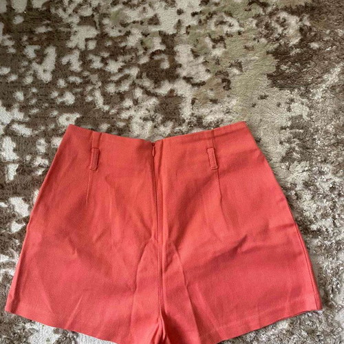 Coral shorts used, size 34