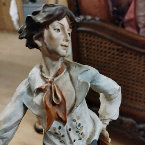 Boy statue with wooden base like new, height 35cm