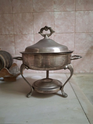 Serving dish used for keeping food warm with paraffin wax base