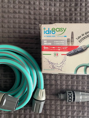 Garden hose new with watering attachment and quick connector