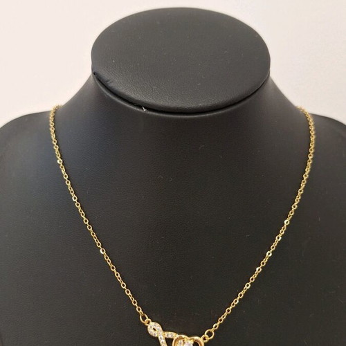 Stainless steel necklace new in gold color with infinity and heart design