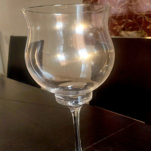 Glass vase with foot like new, tall decorative table piece