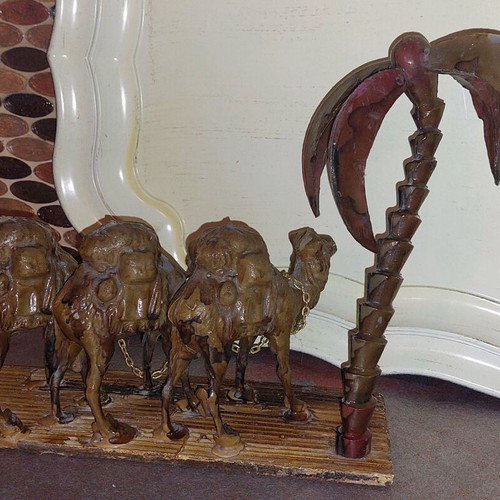 Decorative item used with camels and palm tree made of wood and plastic