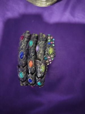 Bracelet with various designs and colored stones like new
