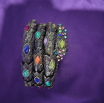 Bracelet with various designs and colored stones like new