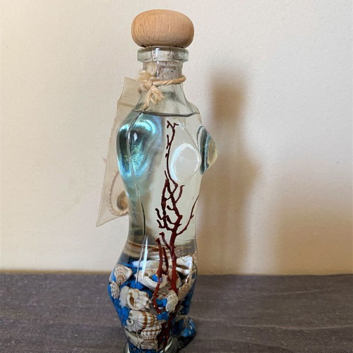 Female figure candle new with shells and stones