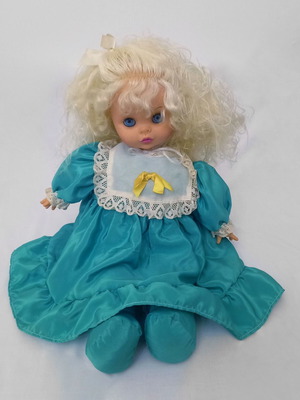 Vintage doll from the 80s 50cm with authentic green dress used