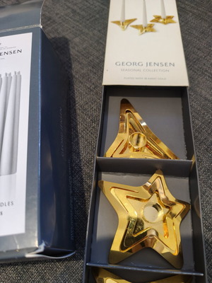 Georg Jensen gold-plated star candle holders with candles